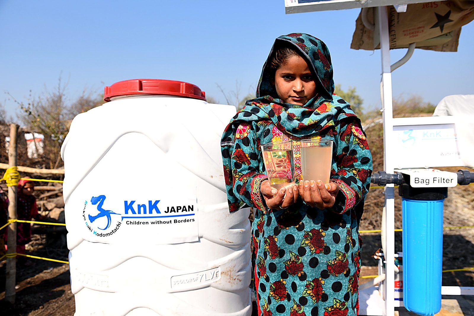 The same source: cloudy groundwater beside safe, filtered drinking water